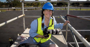Photographer Vicki Yen on a construction site with camera
