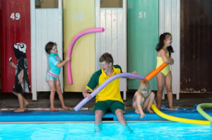 children playing at a pool
